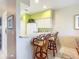 Kitchen with breakfast bar and two wicker stools at 2700 N Peninsula Ave # 536, New Smyrna Beach, FL 32169