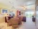 Dining area with wicker furniture and view of living room at 2700 N Peninsula Ave # 536, New Smyrna Beach, FL 32169