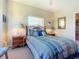 Cozy bedroom with wicker furniture and ocean-themed decor at 2700 N Peninsula Ave # 536, New Smyrna Beach, FL 32169