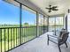 Screened balcony with outdoor seating and scenic views at 2700 N Peninsula Ave # 536, New Smyrna Beach, FL 32169