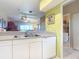 Kitchen with sink, dishwasher, and view into living area at 2700 N Peninsula Ave # 536, New Smyrna Beach, FL 32169