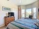 Bedroom with a queen bed, multiple windows, and a view at 2700 N Peninsula Ave # 536, New Smyrna Beach, FL 32169