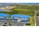 Modern condo building with blue roofs and covered parking, near the water at 2700 N Peninsula Ave # 536, New Smyrna Beach, FL 32169