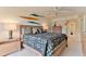 King-size bed, ceiling fan and ensuite bathroom access at 3001 S Atlantic Ave # 502, New Smyrna Beach, FL 32169