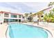 Relaxing community pool with plenty of lounge chairs for sunbathing at 3001 S Atlantic Ave # 502, New Smyrna Beach, FL 32169