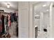 Walk-in closet and bathroom with black and white tile at 3001 S Atlantic Ave # 502, New Smyrna Beach, FL 32169
