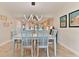 Charming dining area features a light-wood table and chairs at 3001 S Atlantic Ave # 502, New Smyrna Beach, FL 32169