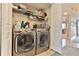Laundry room with washer, dryer, and shelving at 3001 S Atlantic Ave # 502, New Smyrna Beach, FL 32169