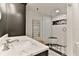 Modern bathroom with marble vanity and walk-in shower at 3001 S Atlantic Ave # 502, New Smyrna Beach, FL 32169