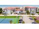 Aerial view showing condo complex and tennis court at 3001 S Atlantic Ave # 502, New Smyrna Beach, FL 32169