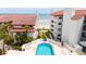 Inviting community pool with ocean view and lounge chairs at 3001 S Atlantic Ave # 502, New Smyrna Beach, FL 32169