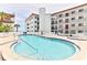 Community pool and hot tub area with lounge chairs at 3001 S Atlantic Ave # 502, New Smyrna Beach, FL 32169
