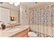 Clean bathroom with shower/tub combo and granite countertop at 3001 S Atlantic Ave # 502, New Smyrna Beach, FL 32169