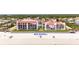 Aerial view of beachfront property showcasing new seawall and beach access at 3001 S Atlantic Ave # 502, New Smyrna Beach, FL 32169