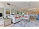 Spacious living area with a sectional sofa and mirrors at 3001 S Atlantic Ave # 502, New Smyrna Beach, FL 32169