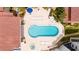 Overhead view of kidney-shaped community pool with hot tub at 3001 S Atlantic Ave # 502, New Smyrna Beach, FL 32169