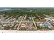 Aerial view of beachfront property, showing building and surrounding neighborhood at 3001 S Atlantic Ave # 502, New Smyrna Beach, FL 32169