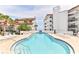 Relaxing community pool with ocean view and ample lounge space at 3001 S Atlantic Ave # 502, New Smyrna Beach, FL 32169