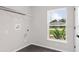 Laundry room with window, shelving and hookups at 362 Oliver Dr, New Smyrna Beach, FL 32168