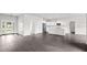 Open concept kitchen with white cabinets, island, and stainless steel appliances at 362 Oliver Dr, New Smyrna Beach, FL 32168