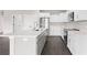 Modern kitchen with white cabinets, quartz countertops and stainless steel appliances at 362 Oliver Dr, New Smyrna Beach, FL 32168