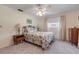 Bedroom with ceiling fan, dresser, and window coverings at 535 S Peninsula Ave, New Smyrna Beach, FL 32169