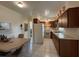Kitchen with wood cabinets, white appliances, and a small dining area at 535 S Peninsula Ave, New Smyrna Beach, FL 32169
