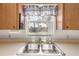 Double stainless steel sink with a view of the backyard at 535 S Peninsula Ave, New Smyrna Beach, FL 32169