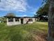 Side view of the house showing large windows at 535 S Peninsula Ave, New Smyrna Beach, FL 32169
