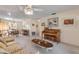 Spacious living room with adjacent dining area and piano at 535 S Peninsula Ave, New Smyrna Beach, FL 32169