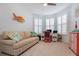 Bright home office with built-in seating and window shutters at 933 Attitude Ave, Daytona Beach, FL 32124