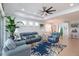 Comfortable living room with a ceiling fan and blue sofa at 933 Attitude Ave, Daytona Beach, FL 32124