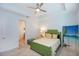 Guest bedroom with a green bed frame and beach-themed decor at 933 Attitude Ave, Daytona Beach, FL 32124