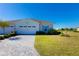 Two-car garage and attractive landscaping enhance this charming home's curb appeal at 933 Attitude Ave, Daytona Beach, FL 32124