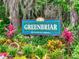 Greenbriar Deed Restricted Community sign with lush landscaping at 6180 Olympic Ct, Port Orange, FL 32127