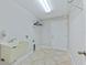 Laundry room with utility sink and ample storage at 756 Bay Dr, New Smyrna Beach, FL 32168