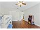Bedroom featuring wood floors, a bunk bed, and an arcade game at 756 Bay Dr, New Smyrna Beach, FL 32168