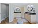 Spacious bathroom with double vanity, corner jacuzzi tub, and separate toilet at 756 Bay Dr, New Smyrna Beach, FL 32168
