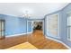 Formal dining room with hardwood floors and views to the living room at 756 Bay Dr, New Smyrna Beach, FL 32168