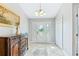 Bright entryway with tiled floor, decorative console table, and white door at 756 Bay Dr, New Smyrna Beach, FL 32168