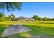 Ranch-style home with a large yard and circular driveway at 756 Bay Dr, New Smyrna Beach, FL 32168