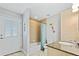 Clean bathroom with tub, shower, and granite countertop at 756 Bay Dr, New Smyrna Beach, FL 32168