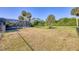 Spacious backyard with fenced area and mature trees at 756 Bay Dr, New Smyrna Beach, FL 32168