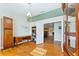 Spacious home office with hardwood floors and views to the living room at 756 Bay Dr, New Smyrna Beach, FL 32168