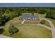 Aerial view of single-story home with large yard and circular driveway at 756 Bay Dr, New Smyrna Beach, FL 32168