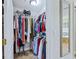 Large walk-in closet, featuring a mirror and plenty of storage at 756 Bay Dr, New Smyrna Beach, FL 32168