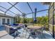 Spacious poolside patio with seating and umbrella at 756 Bay Dr, New Smyrna Beach, FL 32168