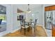 Small breakfast nook with granite table and four chairs near the kitchen at 756 Bay Dr, New Smyrna Beach, FL 32168