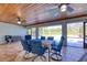 Covered patio with seating area and pool access at 756 Bay Dr, New Smyrna Beach, FL 32168