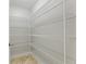 Walk-in pantry with ample shelving for storage at 756 Bay Dr, New Smyrna Beach, FL 32168